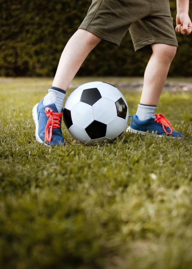 Child kicking a football