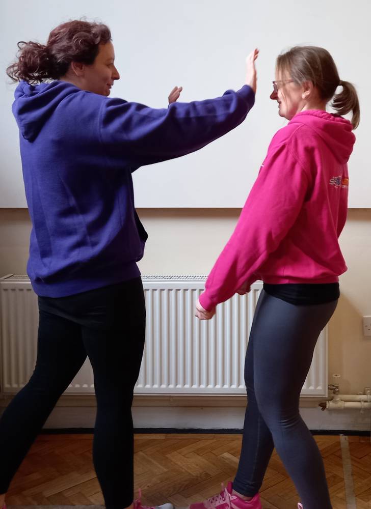 Treat Me Right CIC - two women practising self-defence