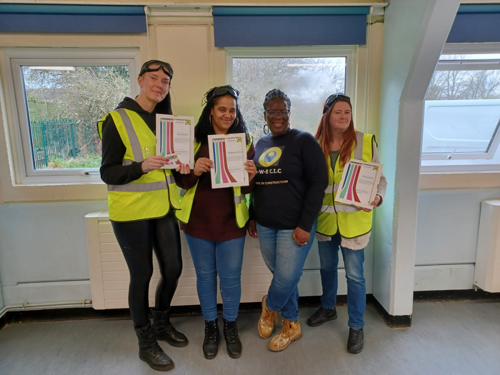 Opportunities with Experience CIC - four women in high-vis jackets holding certificate