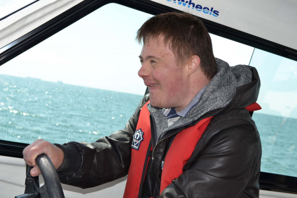 Charity - young man with a disability on a boat