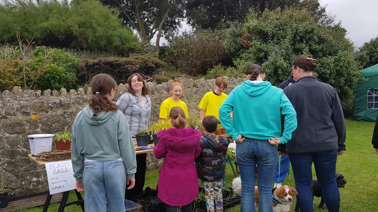 Visitors at eco fair plant stall