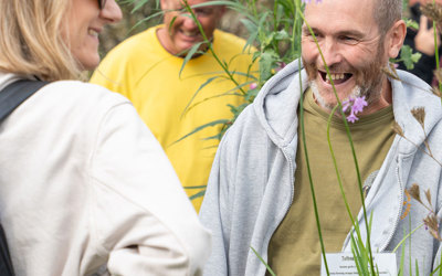 Man smiling in a garden