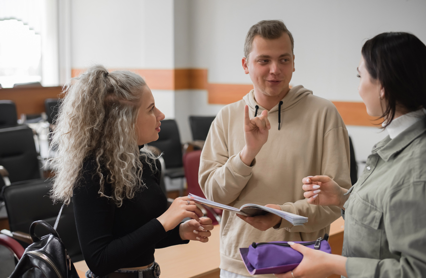 Three young people having a meeting