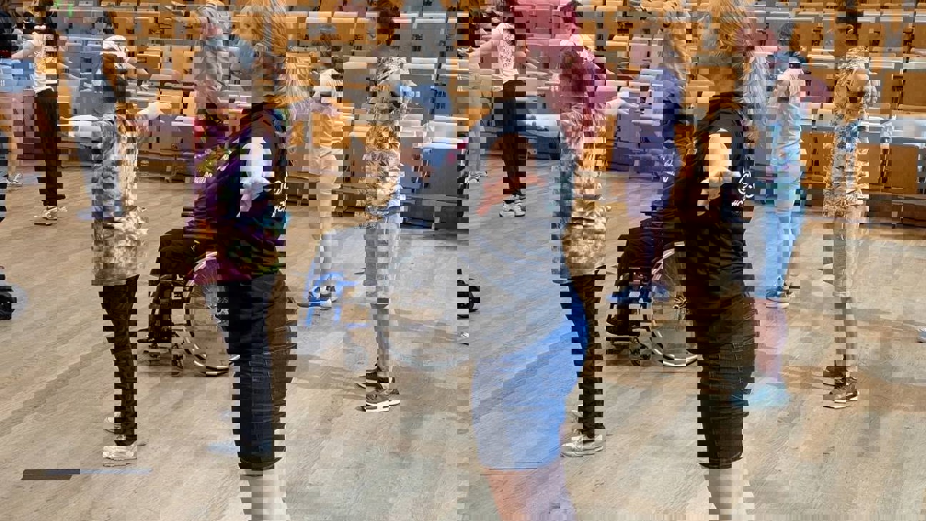 Young people dancing in a school hall