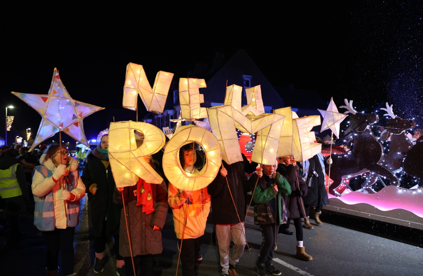 Children taking part in light parade at night